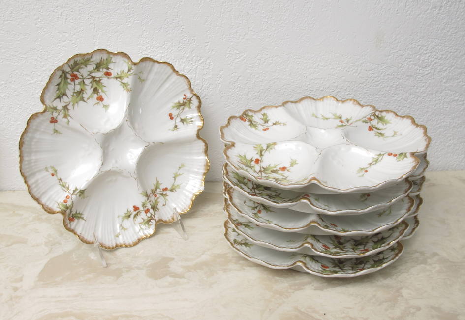 Appraisal: FRENCH LIMOGES OYSTER PLATES Tressemann Vogt red berry and leaf