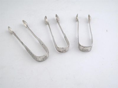 Appraisal: Channel Isles three pairs of fiddle pattern sugar tongs one