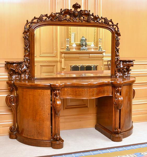 Appraisal: VICTORIAN OAK MIRROR BACK SIDEBOARD WITH SEPENTINE SHAPED CENTRE DRAWER