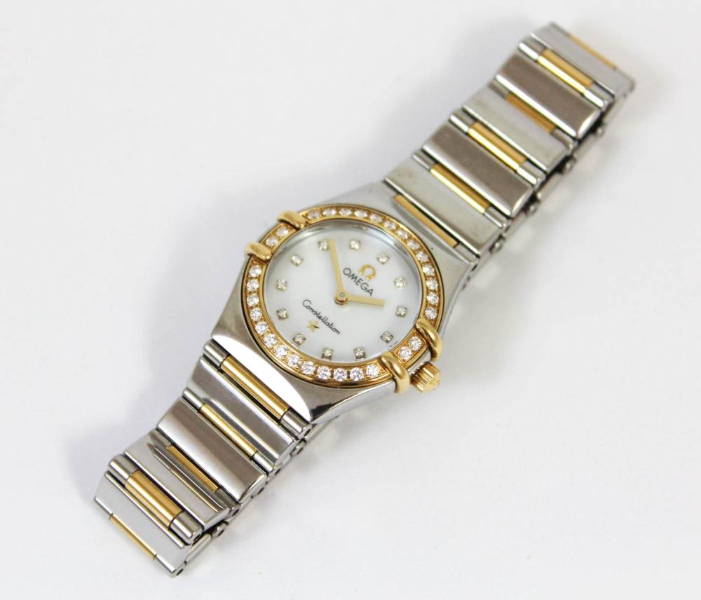 Appraisal: LADIES CONSTELLATION TWO TONE WRISTWATCH having goldtone bezel inset with