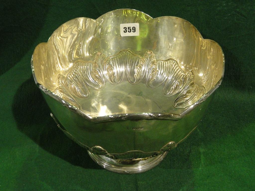 Appraisal: An Art Nouveau silver bowl with scalloped rim and embossed