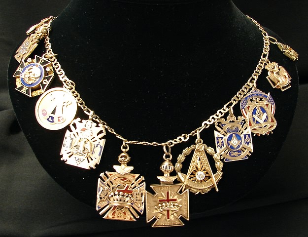 Appraisal: KY gold chain with KY and KY masonic charms attached