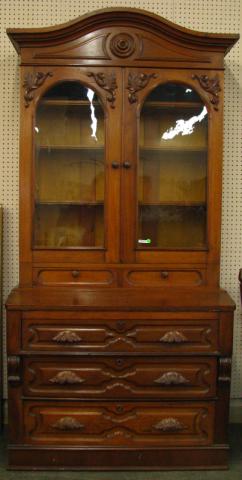 Appraisal: Walnut bookcase-secretary two-piece construction glass doors and two drawers in