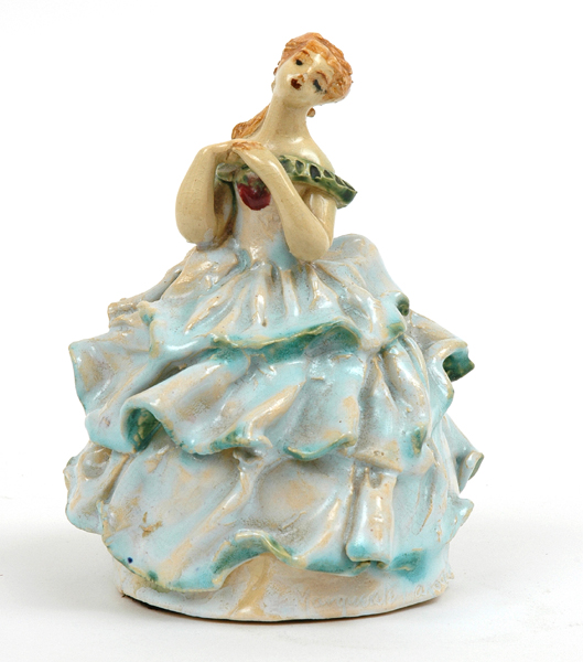 Appraisal: MARGUERITE MAHOOD - Victoria circa An earthenware figure of a