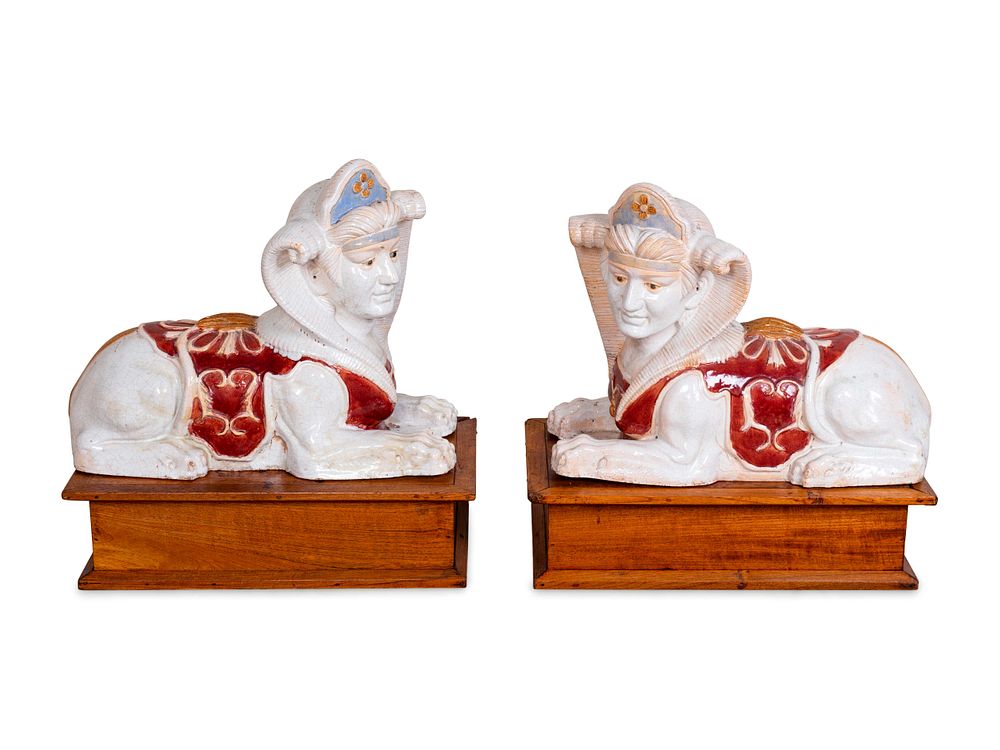 Appraisal: A Pair of Polychromed Ceramic Sphinxes Height x length x