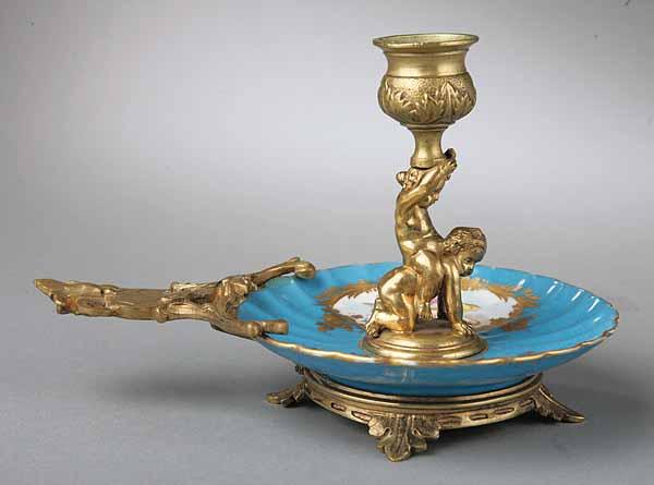 Appraisal: A S vres Polychrome Porcelain and Polished Brass Chamber Stick