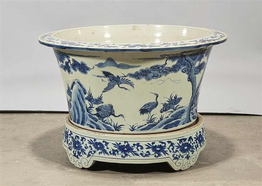 Appraisal: Chinese blue and white porcelain jardiniere depicting birds and landscapes