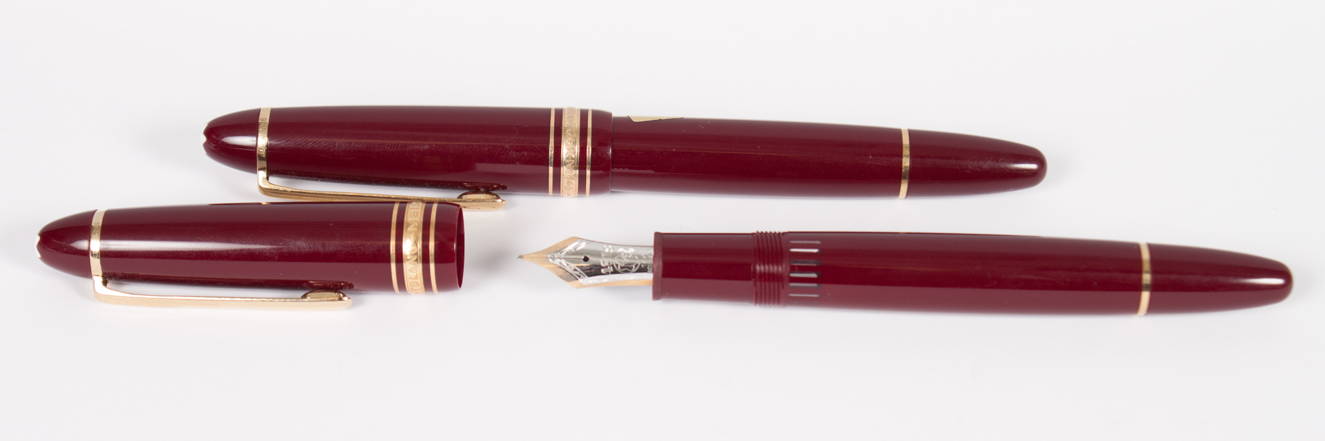 Appraisal: Two Montblanc Meisterstuck fountain pens burgundy cases