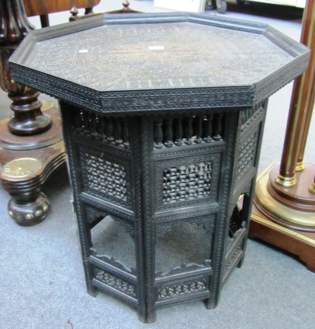 Appraisal: A th century Indian carved ebony occasional table the octagonal