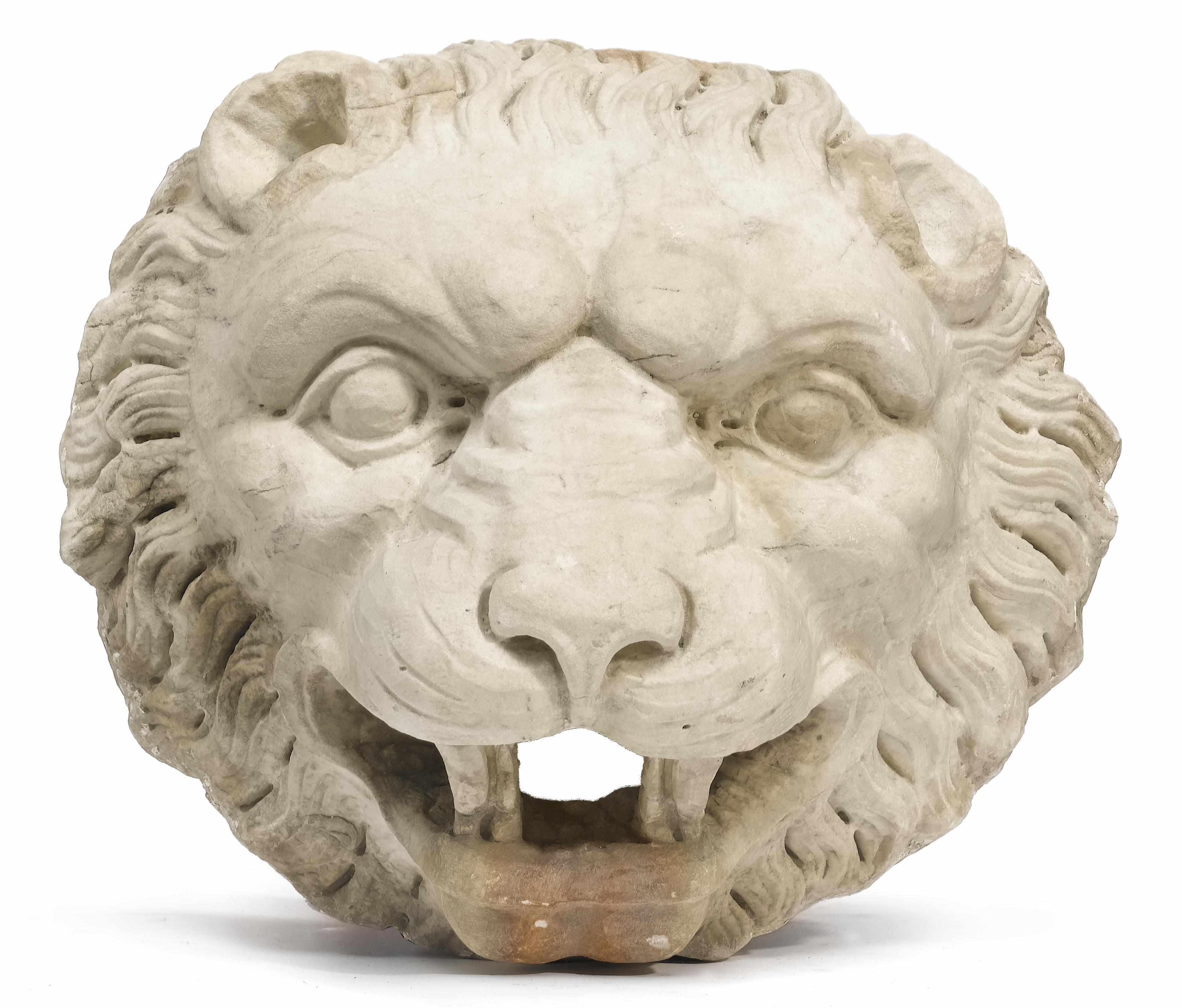 Appraisal: An Italian carved marble fountainhead modeled as a lion mask