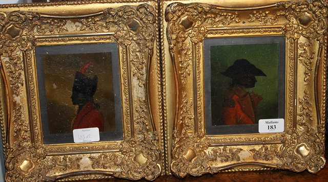 Appraisal: A pair of miniature silhouette portraits of gentlemen in army