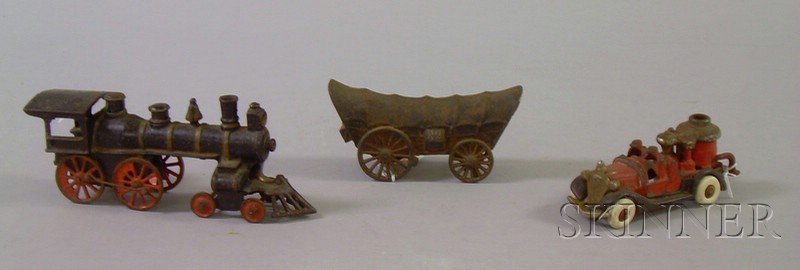 Appraisal: Painted Cast Iron Conestoga Wagon Steam Train Engine and Fire