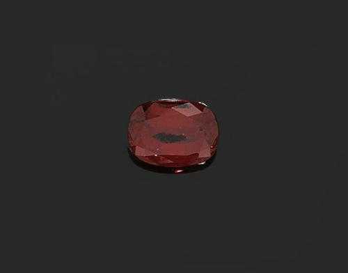 Appraisal: UNMOUNTED SPINEL Antique oval luminous red-orange spinel of ct