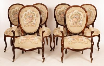 Appraisal: A set of six rosewood framed salon chairs upholstered with