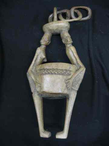 Appraisal: South African Wood Carving man woman holding a pot ''