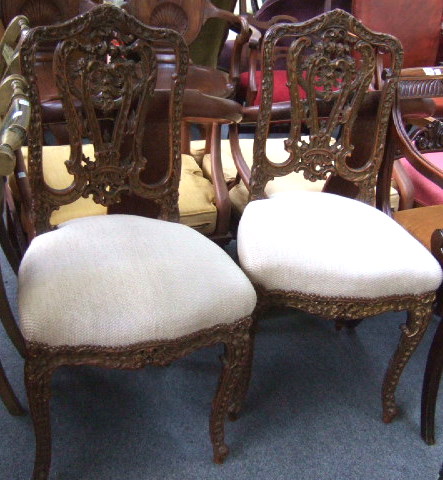 Appraisal: A pair of profusely carved th century side chairs with