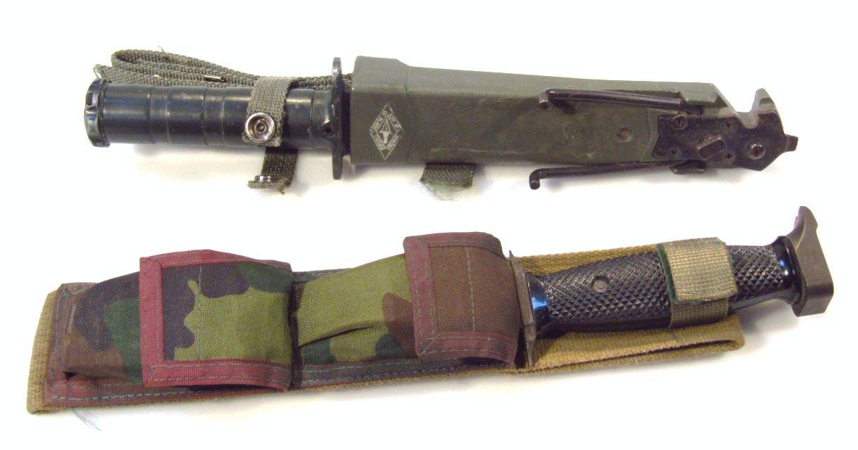 Appraisal: A thC survival kit dagger with plastic sheath and metal