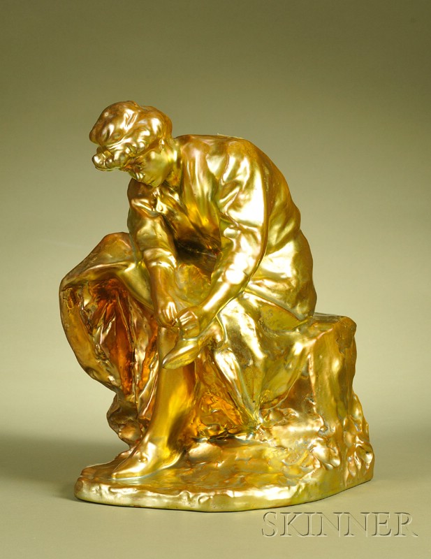 Appraisal: Zsolnay Iridescent Gold Figural Group of a Woman Tying Her