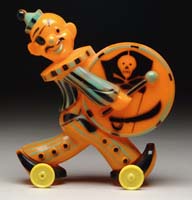 Appraisal: HALLOWEEN PIRATE BANK ON WHEELS Plastic orange pirate with green