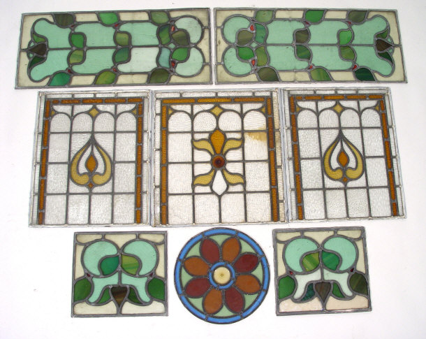 Appraisal: Eight leaded stained glass panels with mostly floral decoration largest