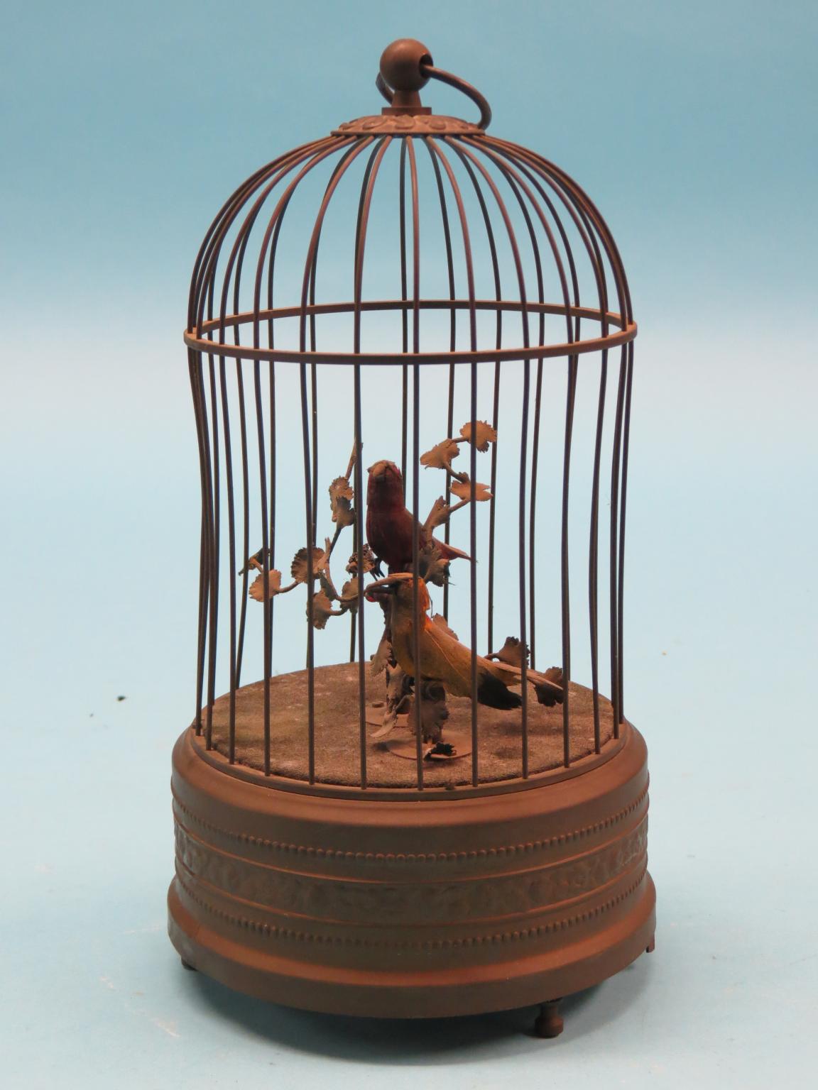 Appraisal: A late th century singing bird automaton in the form