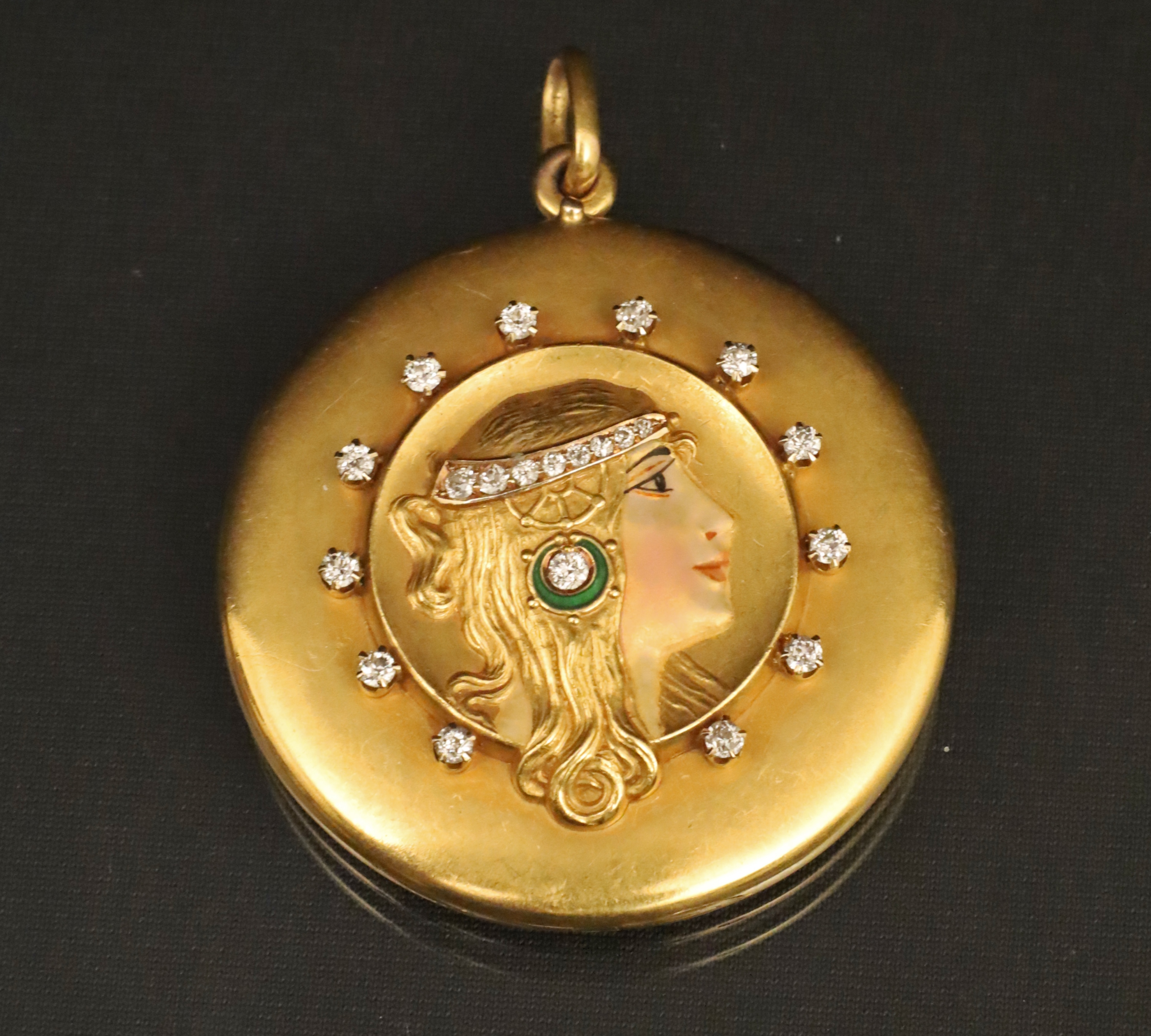 Appraisal: K YG AND DIAMOND PORTRAIT LOCKET K yellow gold and