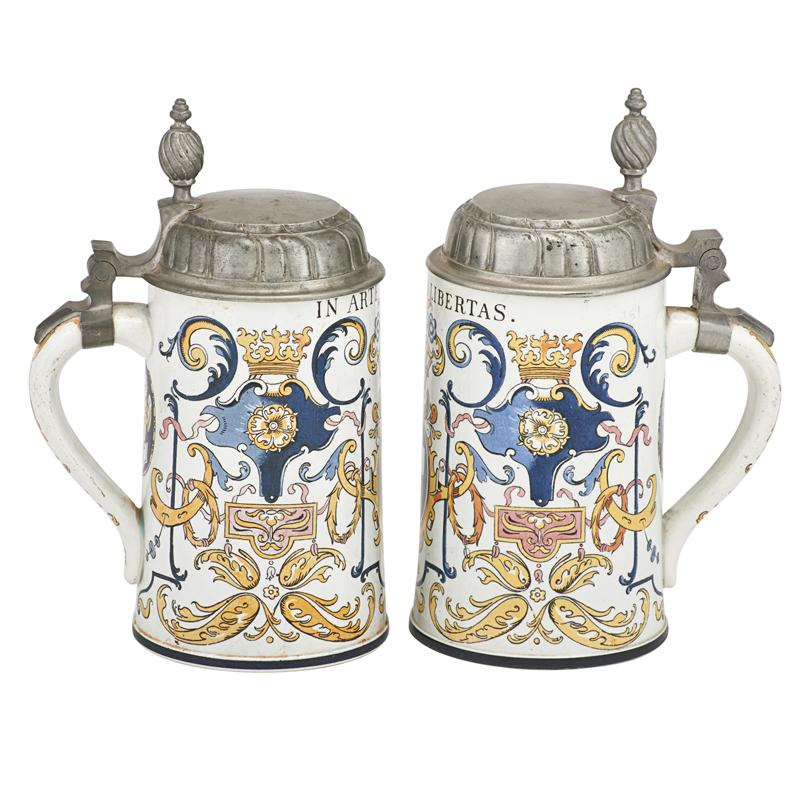 Appraisal: METTLACH FAIENCE STEINS Two Both number half liter with pewter