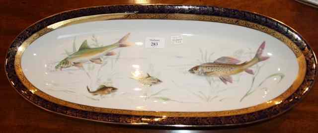 Appraisal: A LIMOGES FISH DISH polychrome decorated with four fish including