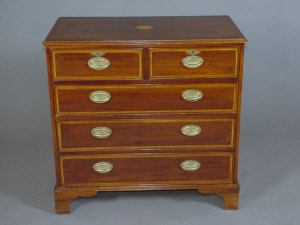 Appraisal: An Edwardian style mahogany and inlaid chest of drawers late