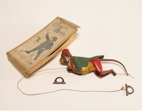 Appraisal: Boxed Lehman German tin litho Climbing Monkey toy flocked frock