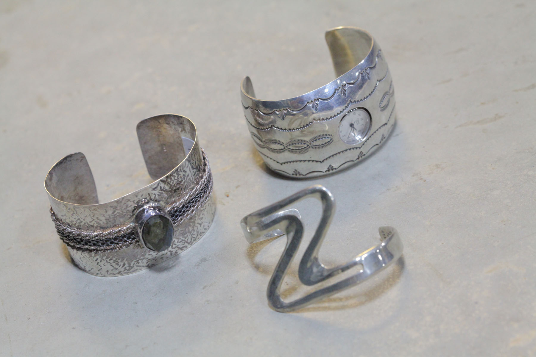 Appraisal: THREE STERLING SILVER BRACELETS American and Mexican th century An