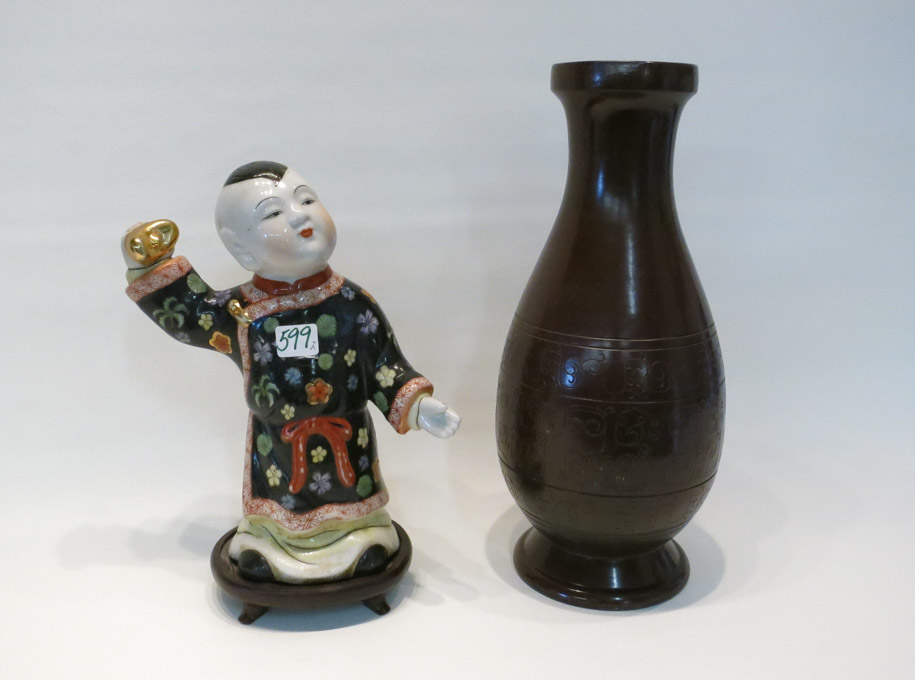 Appraisal: CHINESE PORCELAIN FIGURAL SCULPTURE AND A POTTERY VASE The hand