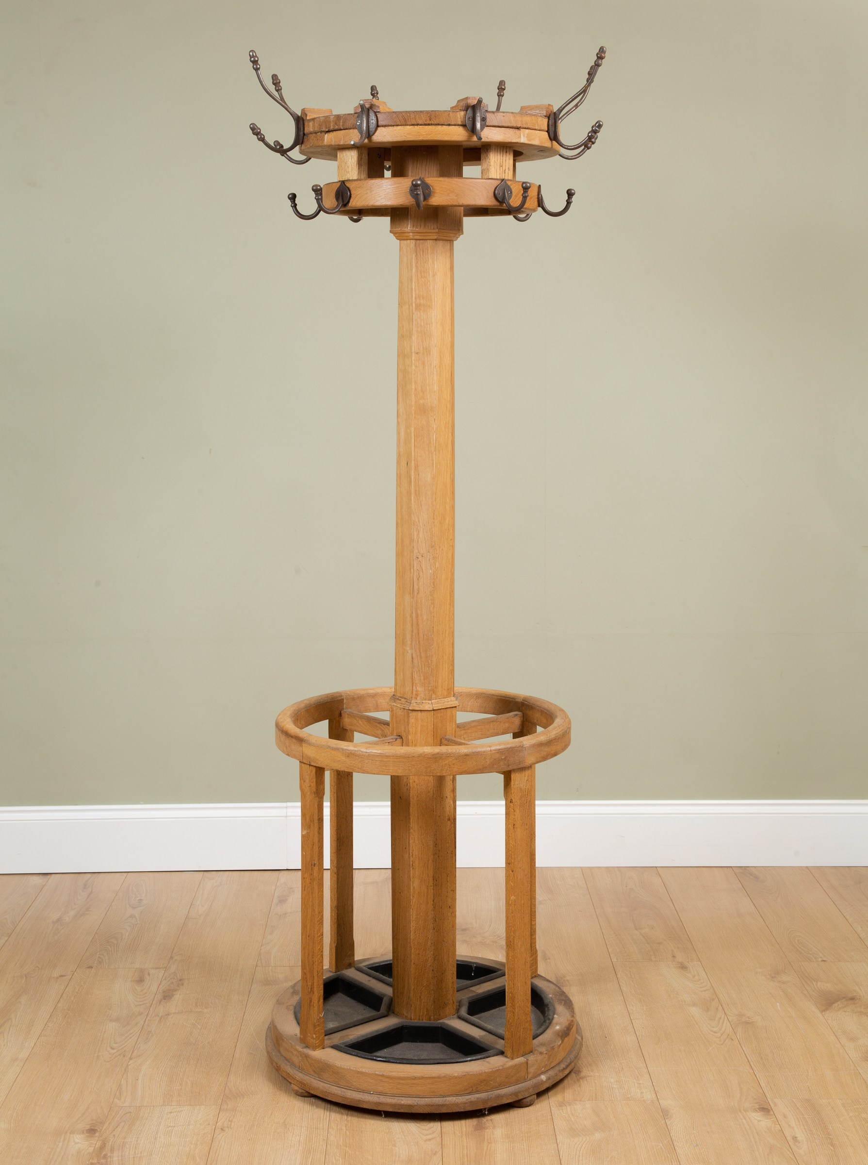 Appraisal: A light oak Arts and Crafts coat and stick stand