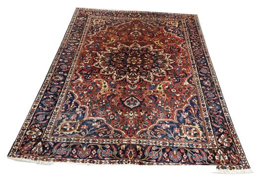 Appraisal: RUGS Semi-Antique Persian Bakhtiari carpet red field central floral form