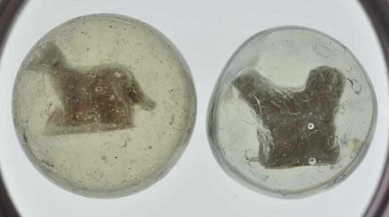 Appraisal: Lot of Dog Sulphide Marbles Description Both with original surfaces