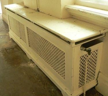 Appraisal: A double pierced cast radiator surround with pierced ends and