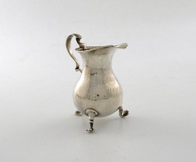 Appraisal: A George III silver cream jug of plain baluster form