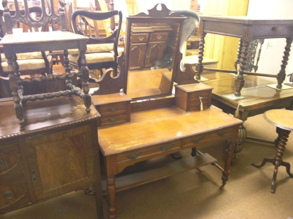 Appraisal: A Victorian walnut dressing table bevelled mirror with arched cresting