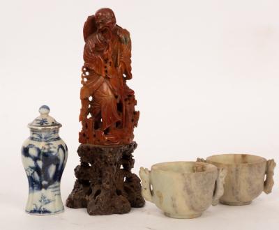 Appraisal: A Shoushan stone carved fisherman on a hollowed stone plinth