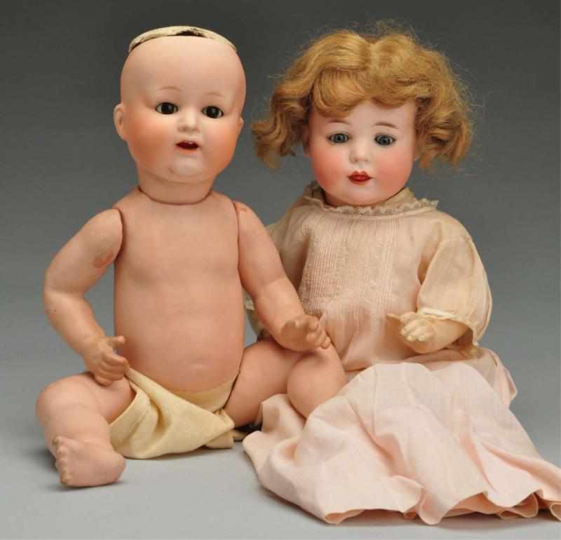 Appraisal: Lot of Character Baby Dolls Description Both with bisque socket