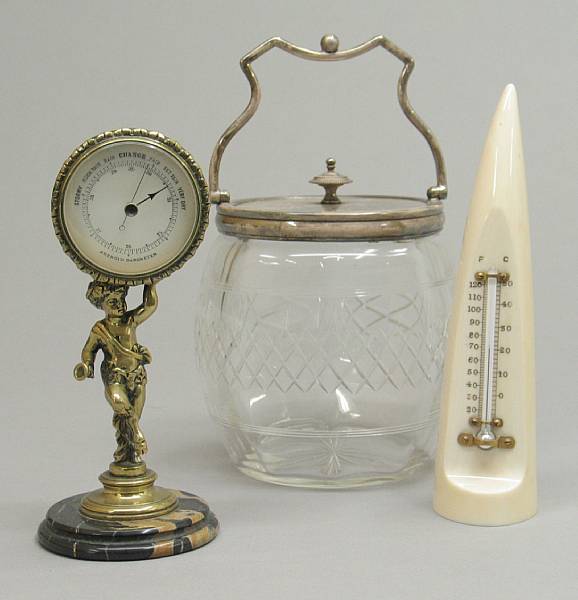 Appraisal: An English cast brass figural weather gauge ivory thermometer and