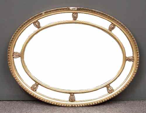 Appraisal: A gilt framed oval wall mirror of Georgian design with