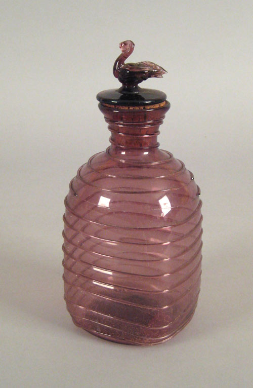 Appraisal: Amethyst blown glass bottle th c with swan stopper h