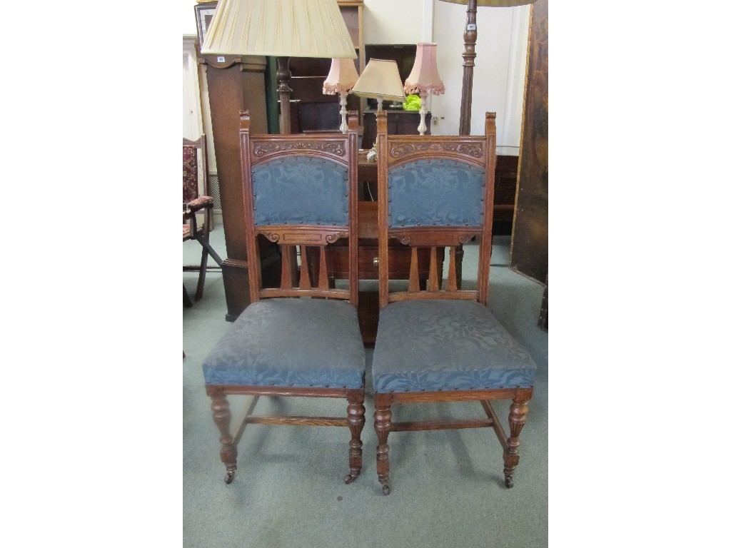 Appraisal: Pair of Edwardian oak dining hall chairs