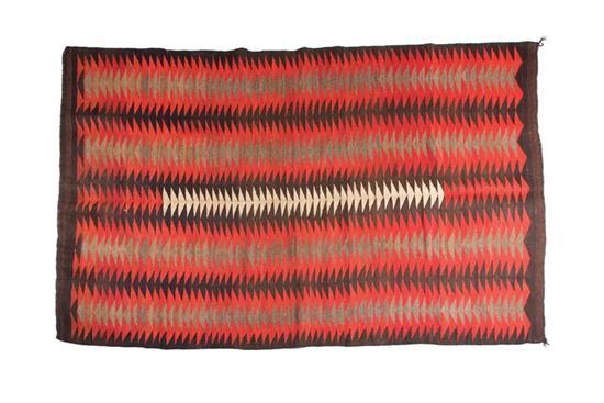 Appraisal: NAVAJO RUG Twentieth century Zigzag pattern in black brown red