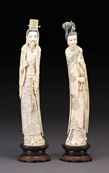 Appraisal: A pair of tinted ivory standing figures of an emperor