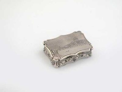 Appraisal: A Victorian vinaigrette of shaped oblong outline engraved on the