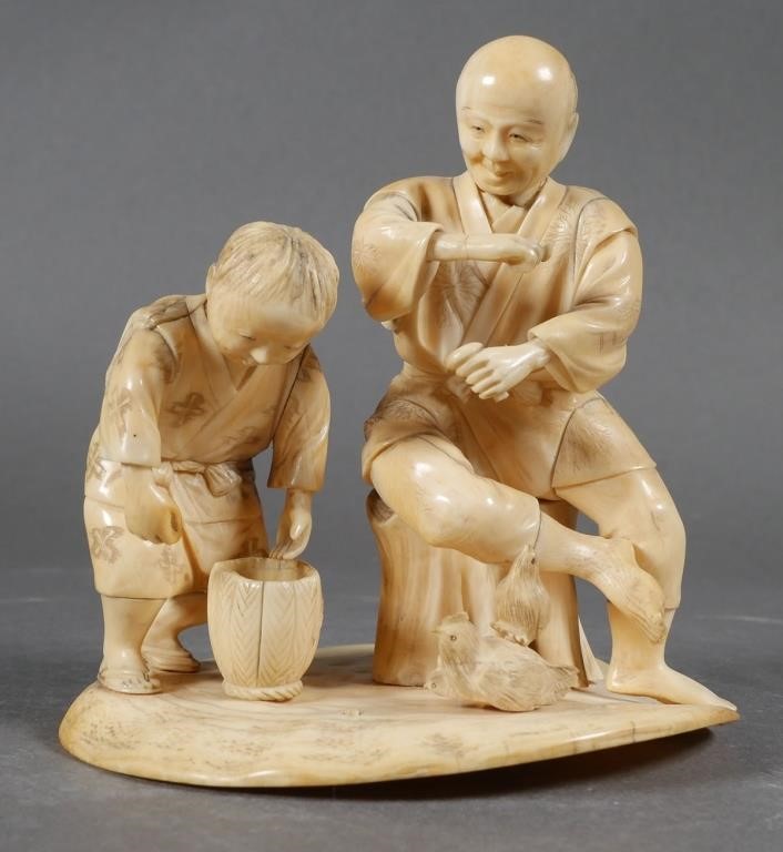 Appraisal: Antique Japanese carved ivory figural group Seated man feeding birds