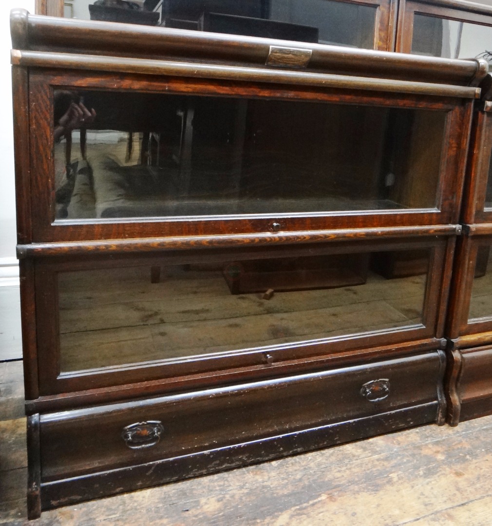 Appraisal: A near pair of Globe Wernicke oak two tier bookcases