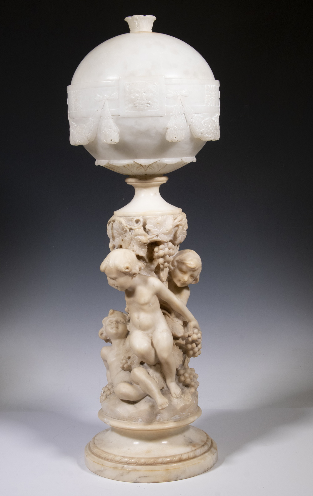 Appraisal: ALABASTER SCULPTURAL TABLE LAMP WITH PUTTI Italian Art Nouveau Carved